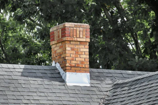 Banded brick chimney with new flashing